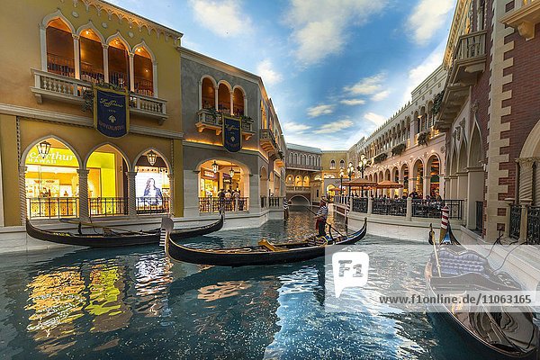 Replica of Venice  Venetian gondolas on canal  artificial sky  The Venetian Resort Hotel Casino  Las Vegas  Nevada  USA  North America