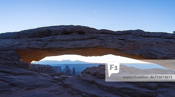 View through Natural Arch  Mesa Arch  Sunrise  Grand View Point Road  Island in the Sky  Canyonlands National Park  Moab  Utah  USA  North America