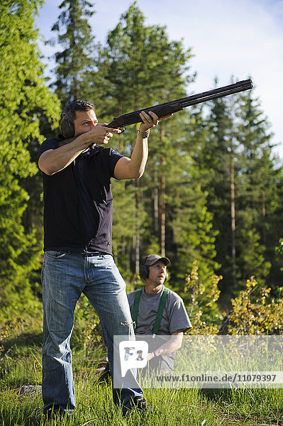 Hunter aiming rifle