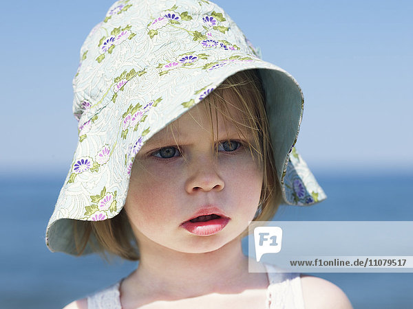 Portrait of girl wearing sun hat