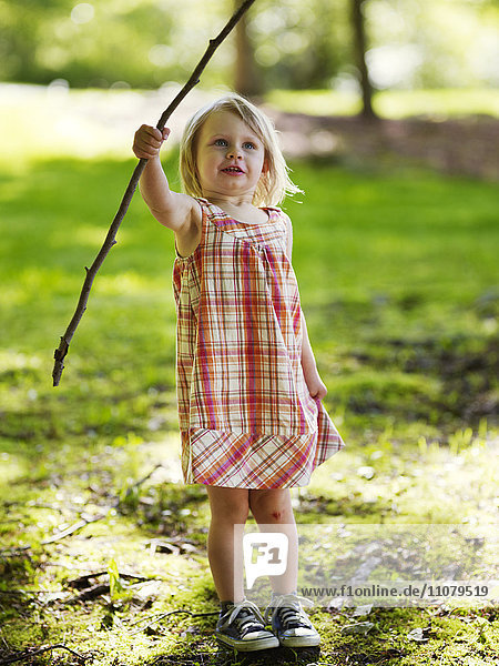 Girl playing with stick