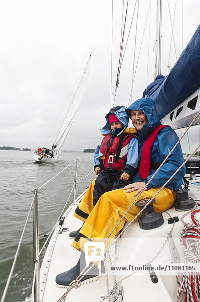 Mother and son in sailing boat