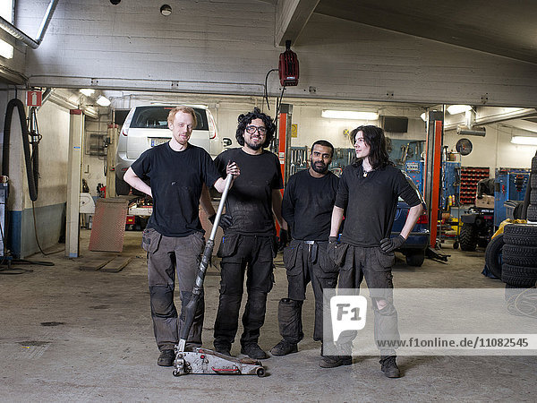 Mechanics in auto repair shop