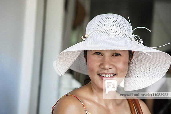 Portrait of smiling woman wearing sun hat  Thailand