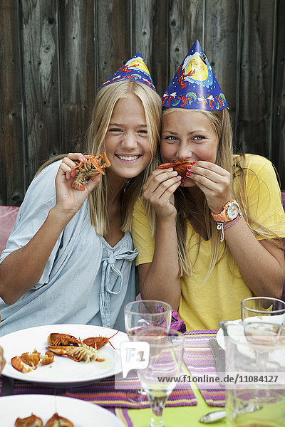 Teenage girls at crayfish party  Sweden