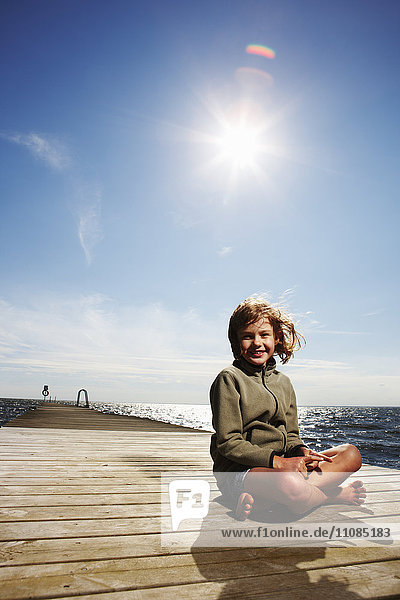 A girl on a jetty  Sweden.