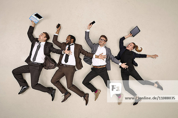 Business colleagues dancing with mobile devices