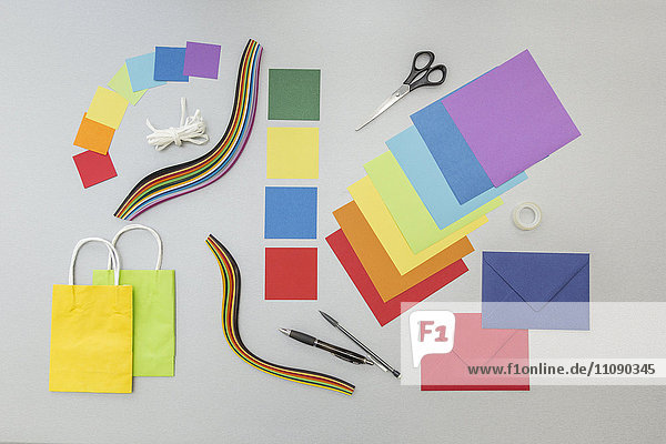 Tools and colourful paper for craft projects