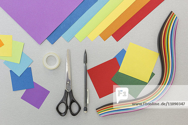 Tools and colourful paper for craft projects