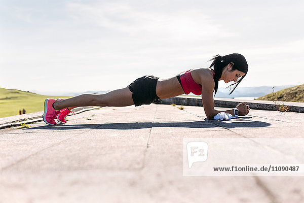 Woman doing push ups  outdoor