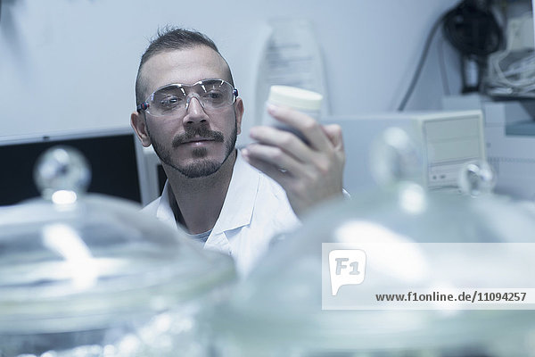 Young scientist working in a pharmacy laboratory