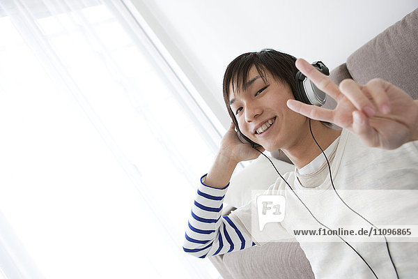 Young Man Listening To Music in Headphones
