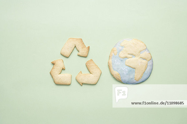 Cookies of recycling symbol and planet earth