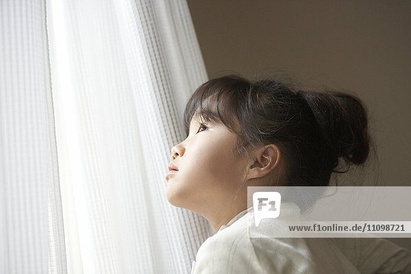 Girl looking out the window