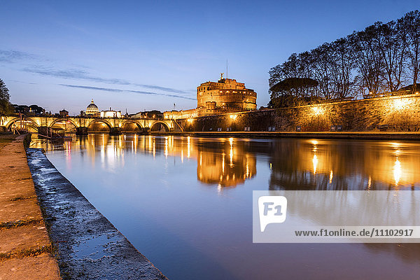 Dusk on the ancient palace of Castel Sant'Angelo with statues of angels on the bridge on Tiber RIver  UNESCO World Heritage Site  Rome  Lazio  Italy  Europe