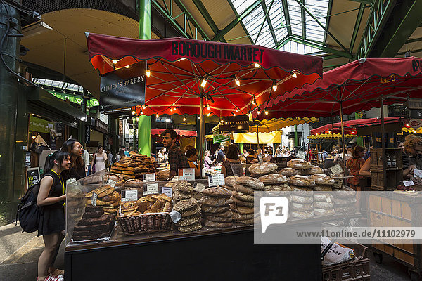 Customers at a bread stall  Borough Market  Britain's most renowned food market  Southwark  London  England  United Kingdom  Europe