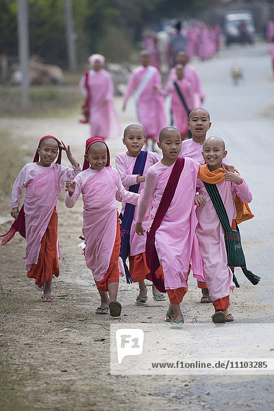 Buddhist nuns in traditional robes  Mandalay  Myanmar  Southeast Asia