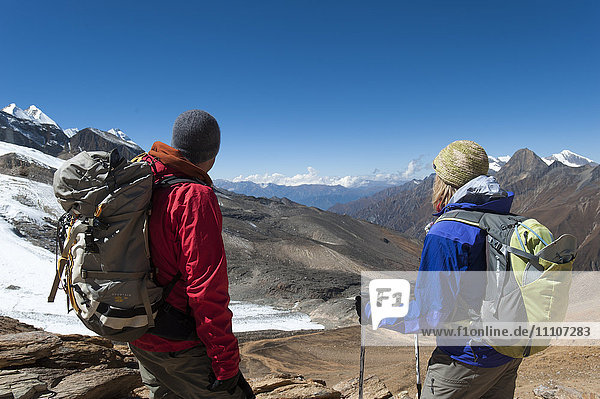 Admiring the view from the top of the Kagmara La  the highest point in the Kagmara Valley at 5115m in Dolpa  Himalayas  Nepal  Asia