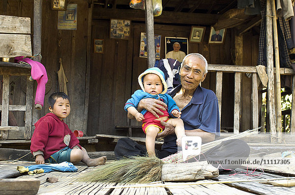 Asia  Myanmar  Kengtung  Shan state  grandfather with his grandchildren and maker of brooms