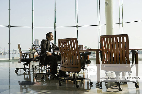 Businessman waiting in conference room for meeting