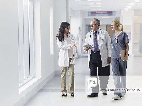 Doctors and nurse talking in hospital