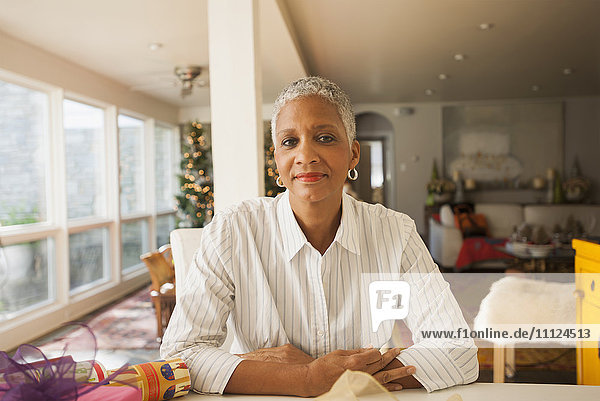 African American woman sitting at table