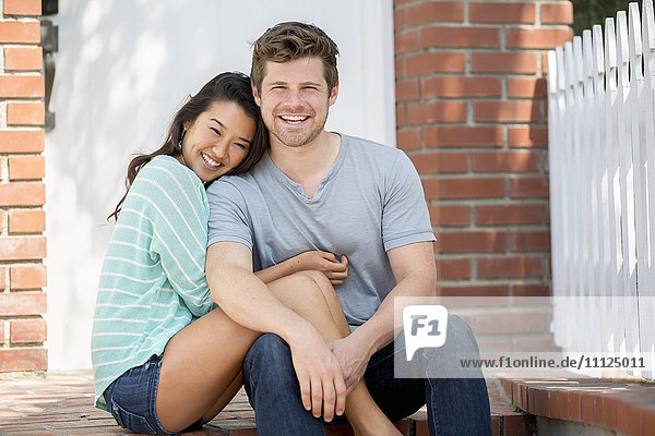 Couple smiling together outdoors