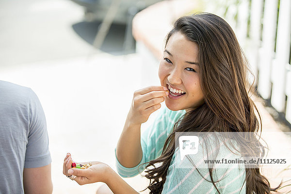 Japanese woman eating outdoors