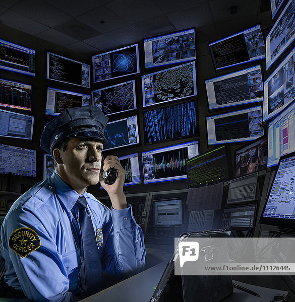 Police officer working in control room