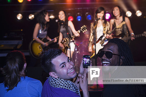 Crowd watching musical group perform