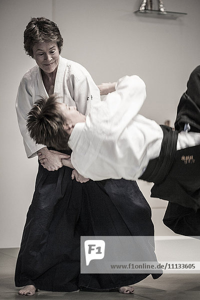 Caucasian people practicing martial arts