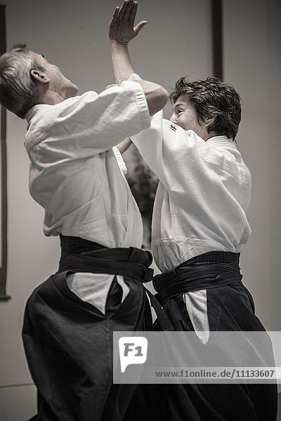 Caucasian people practicing martial arts