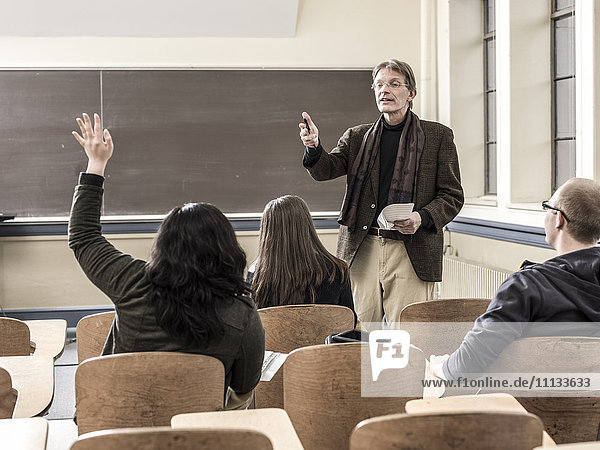 Teacher talking to students in classroom