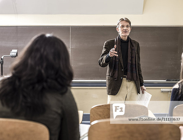 Teacher talking to students in classroom
