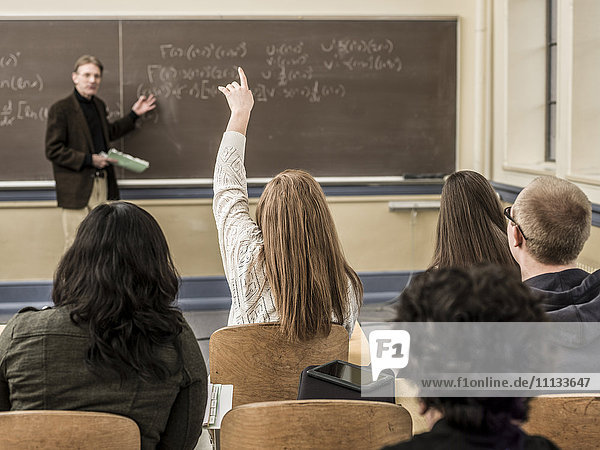 Teacher talking to students in classroom