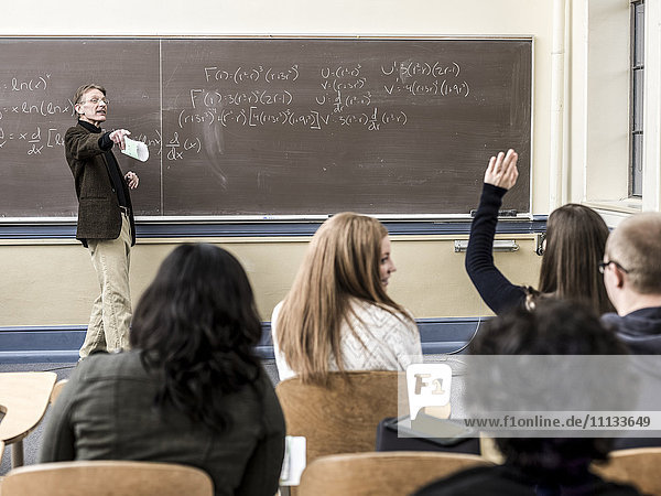 Teacher talking to students in classroom