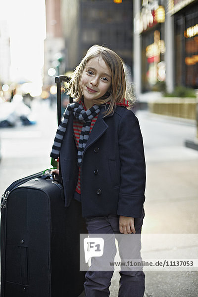Italian girl with suitcase on urban sidewalk