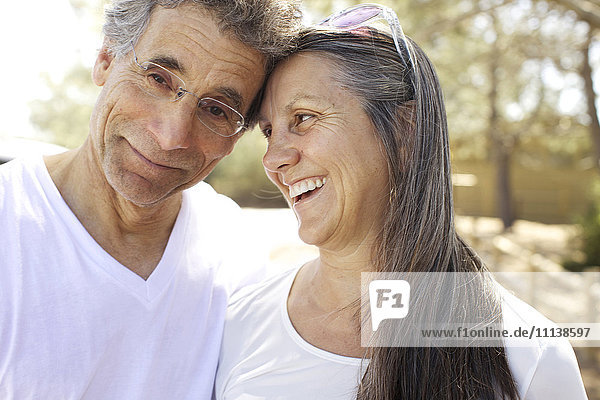 Older Caucasian couple smiling