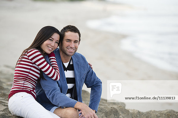 Couple smiling together on beach