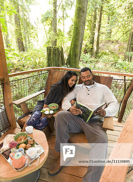 Couple relaxing together on deck