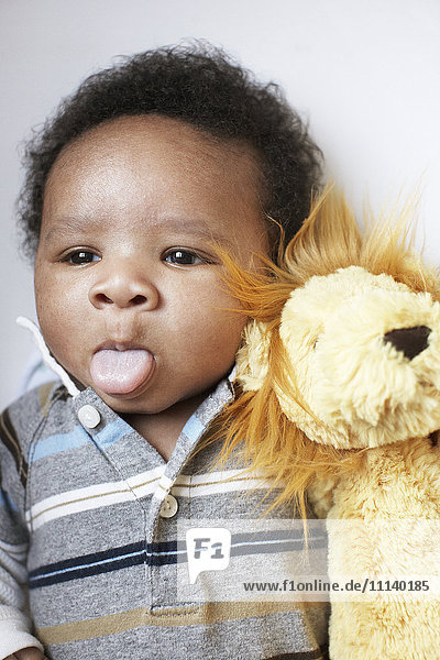 African American baby sticking out tongue