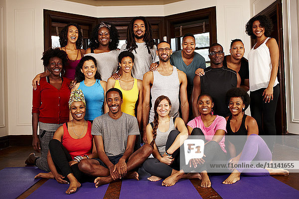 People smiling together in yoga class