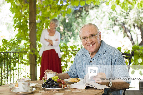Man having breakfast outdoors