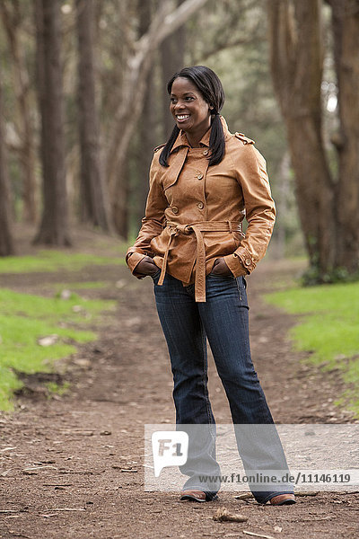 Black woman standing on dirt path