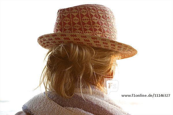 Rear view of woman wearing straw hat