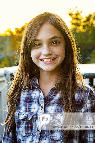 Close up of smiling Caucasian teenage girl