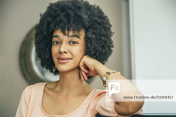 Mixed race woman smiling indoors