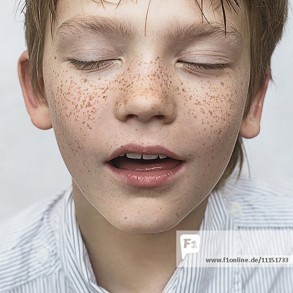 Close up of Caucasian boy with freckles