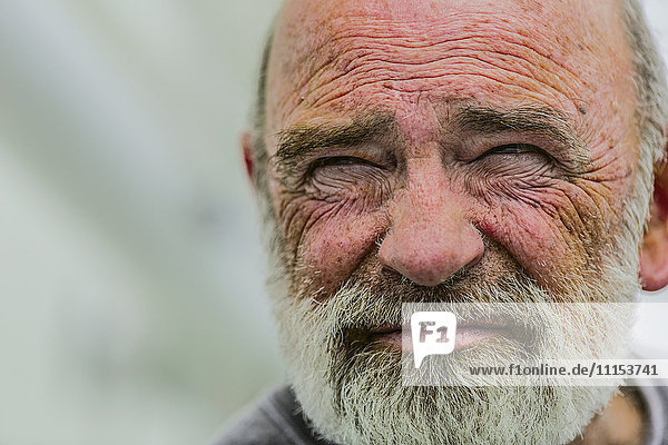 Close up of wrinkled face of Caucasian man