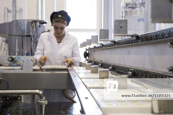 Woman working in a chocolate factory